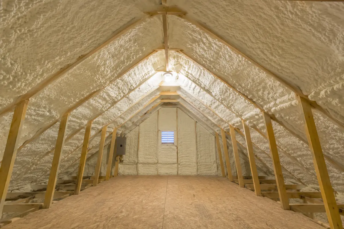 Finished attic insulated with spray foam along the roofline